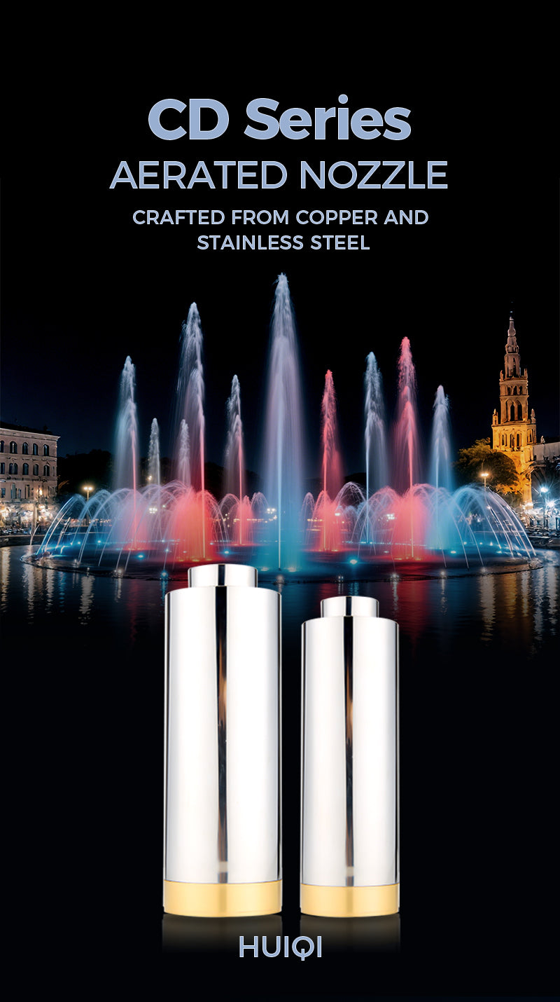 Two silver nozzles with gold accents on a black background with fountains and a building in the background.