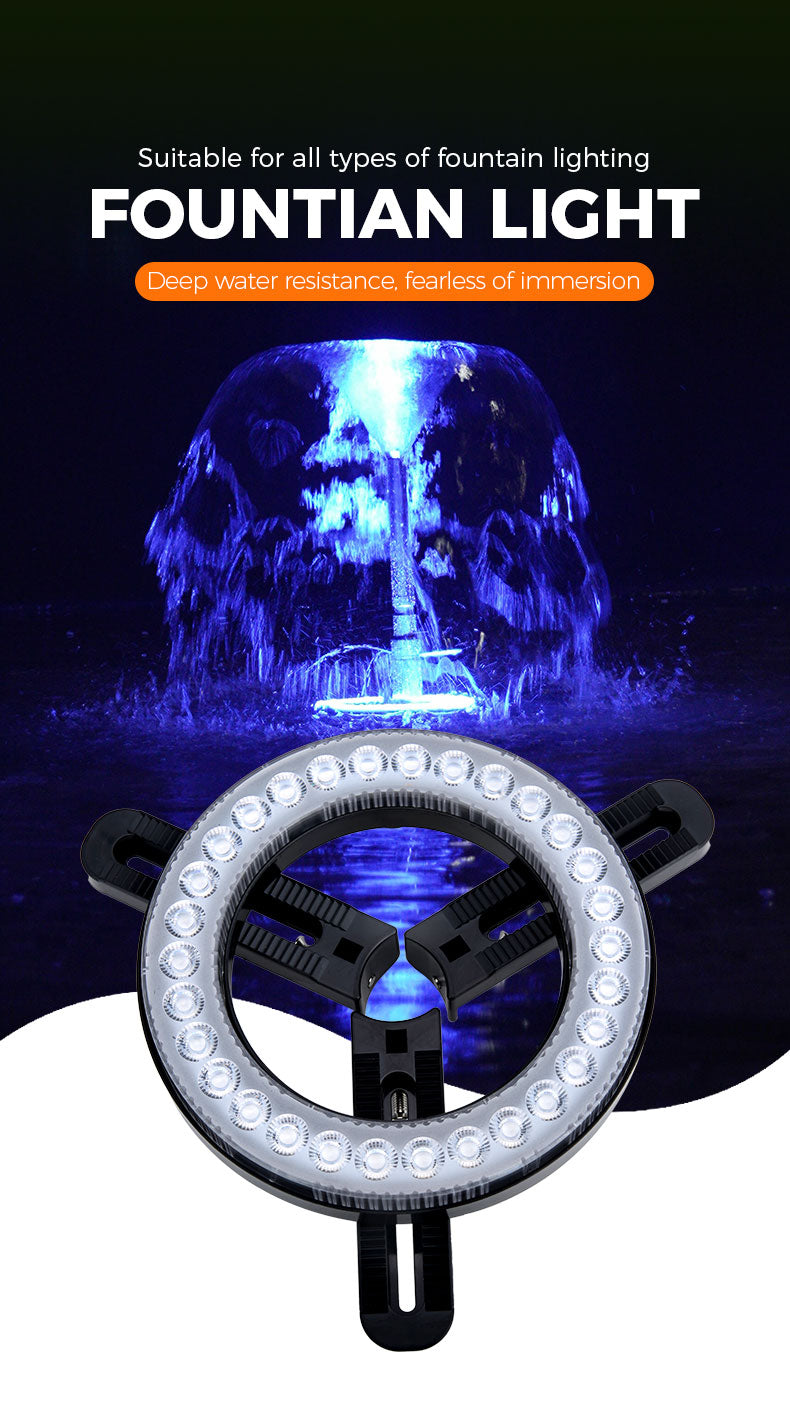 Fountain light with blue water feature on a dark background
