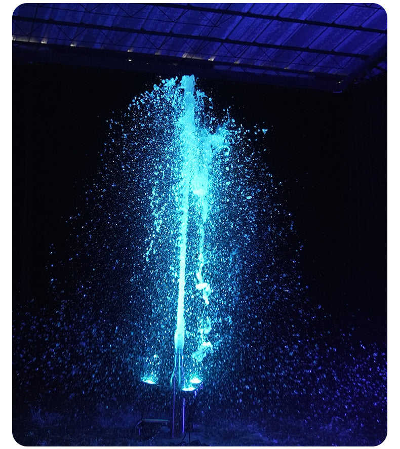 Blue water fountain against a dark background