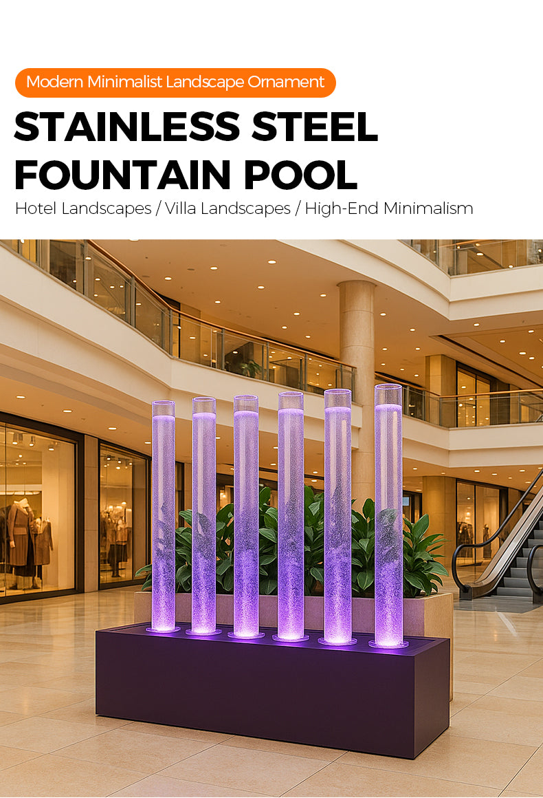 Stainless steel fountain pool with purple lights in a modern indoor setting
