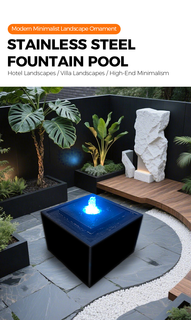 Stainless steel fountain pool in a modern outdoor setting with plants and stone sculpture.
